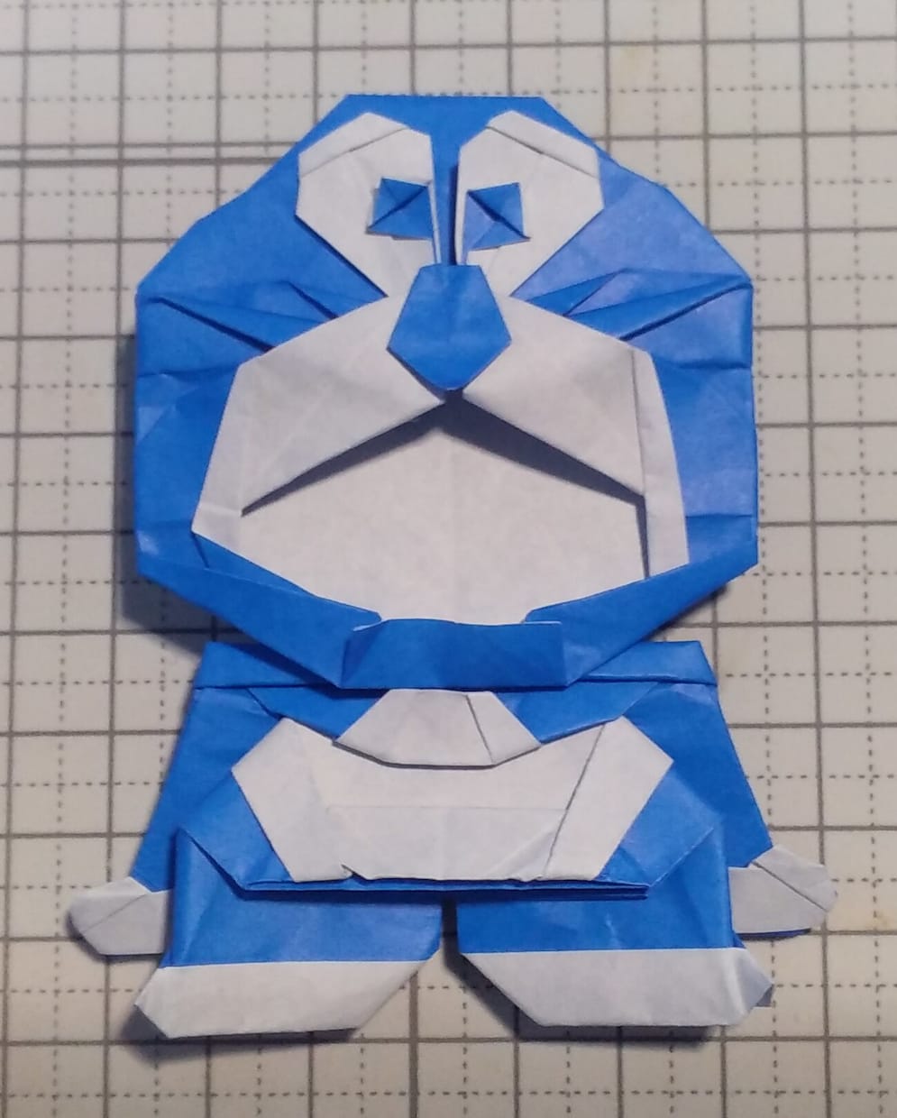 Colourful folded paper character craft demonstrating creative hands-on paper-folding activities that can support tactile mathematics learning